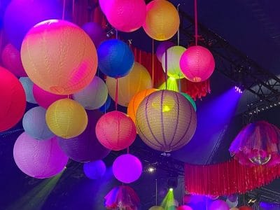 Coloured paper lanterns hanging from a ceiling