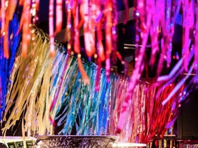 Colourful garlands above a party bar